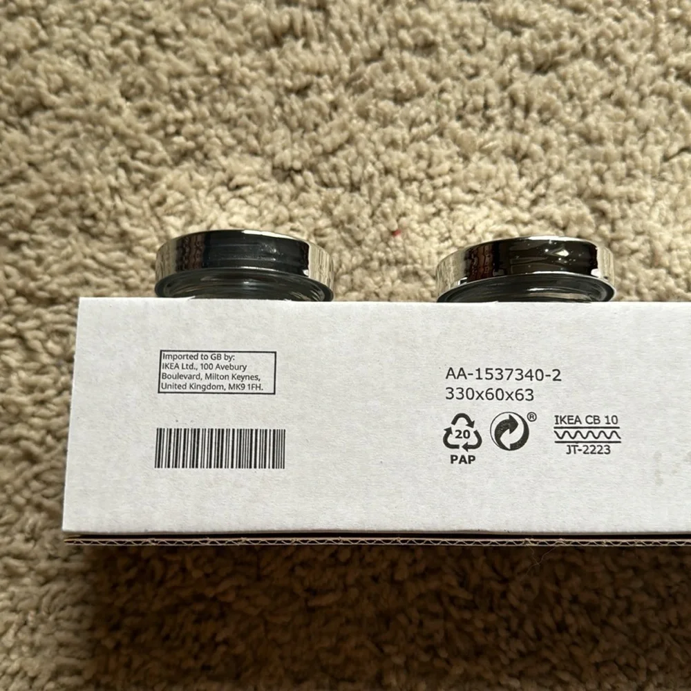 IKEA set of four Rajtan glass spice jars with silver lids